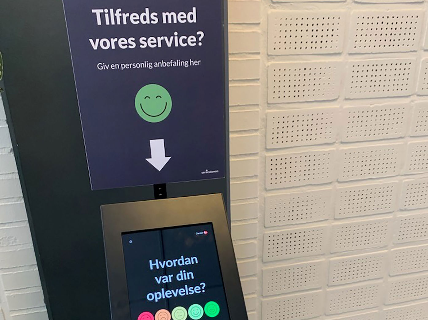 Stander med ordlyden ' Hvor tilfreds er du med vores service?"